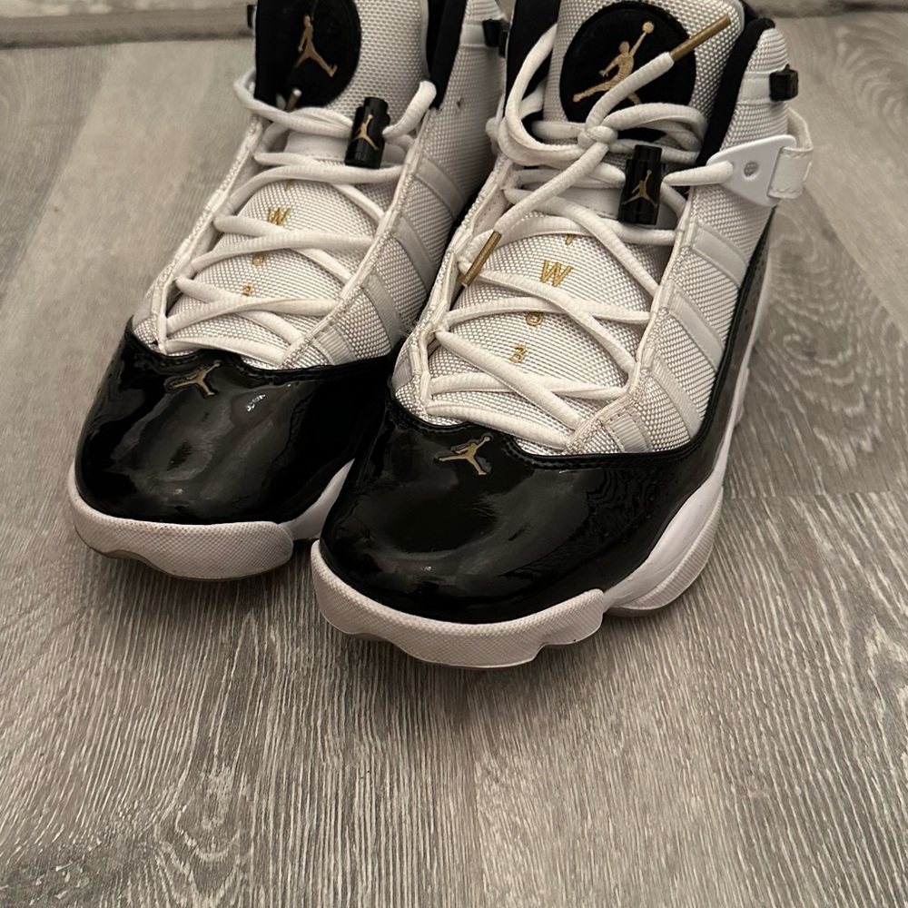 AIR JORDAN Black and White Sneakers with Gold Accents